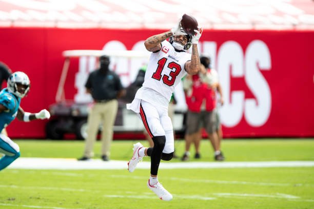 TAMPA, FL - SEPTEMBER 20: Mike Evans #13 of the Tampa Bay Buccaneers makes a reception during the first half of an NFL football game against the Carolina Panthers at Raymond James Stadium on September 20, 2020 in Tampa, Florida. (Photo by Perry Knotts/Getty Images)